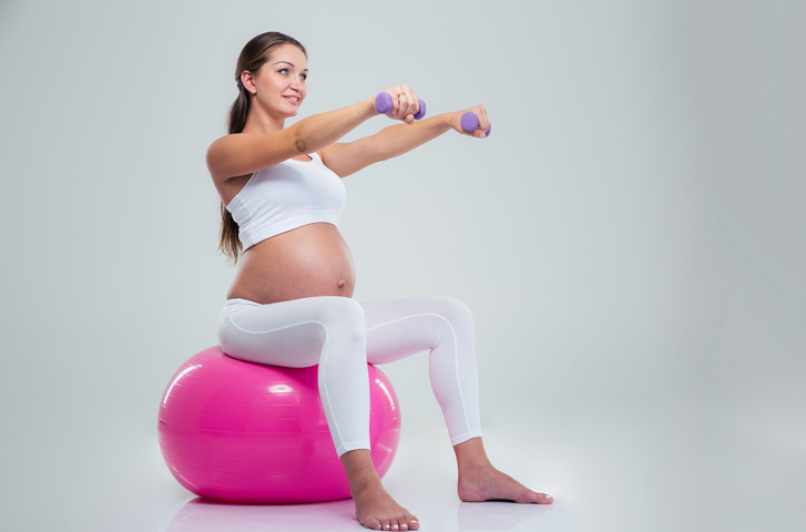 pregnant woman doing ball exercise